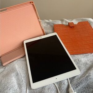 Apple 7th generation IPad  with Orange and Pink Covers